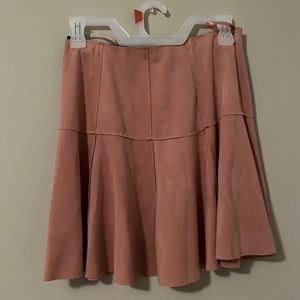 Pink suede skirt.